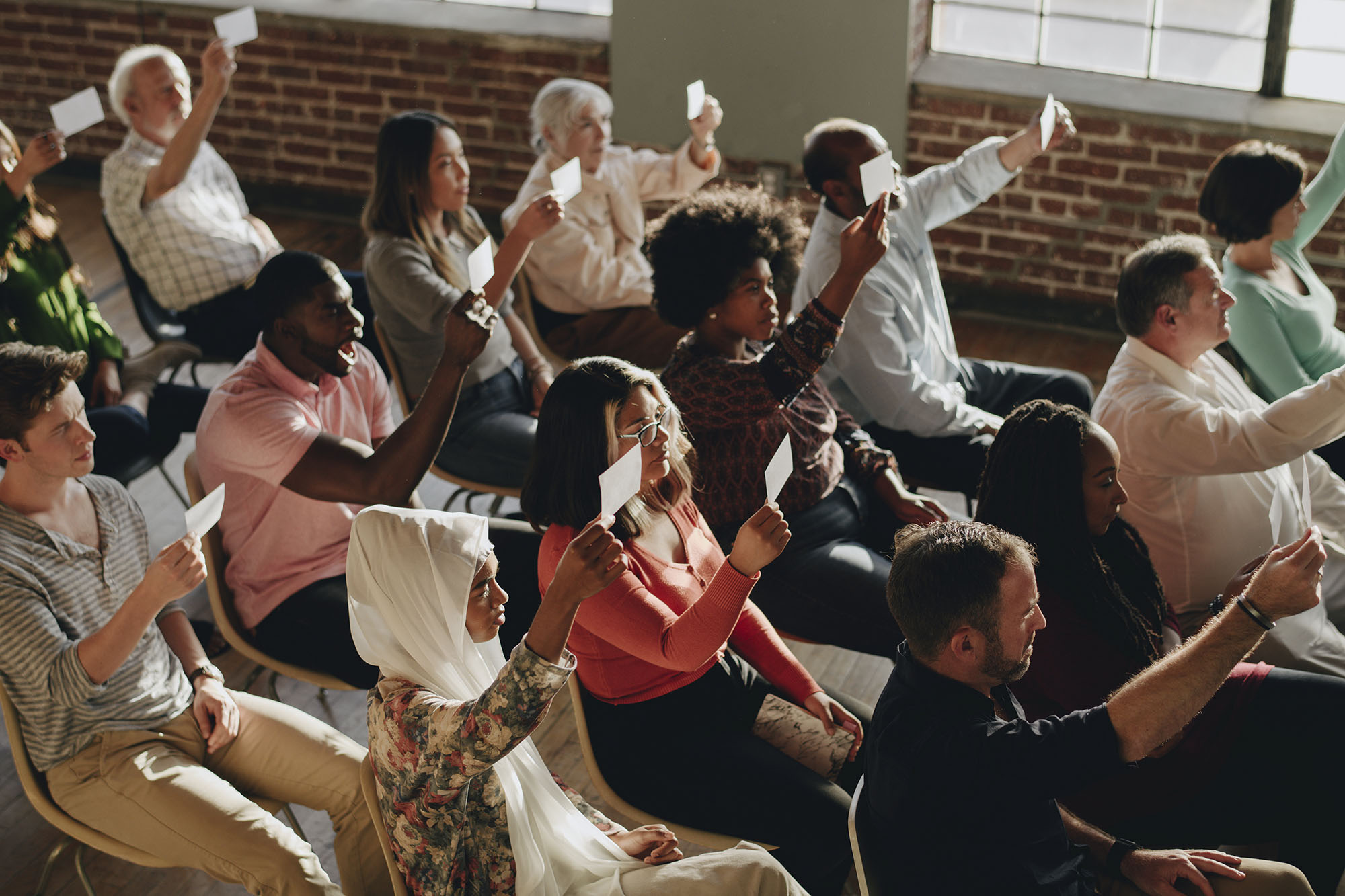 group-of-diverse-voters-showing-ballots-2022-12-16-00-08-53-utc.jpg