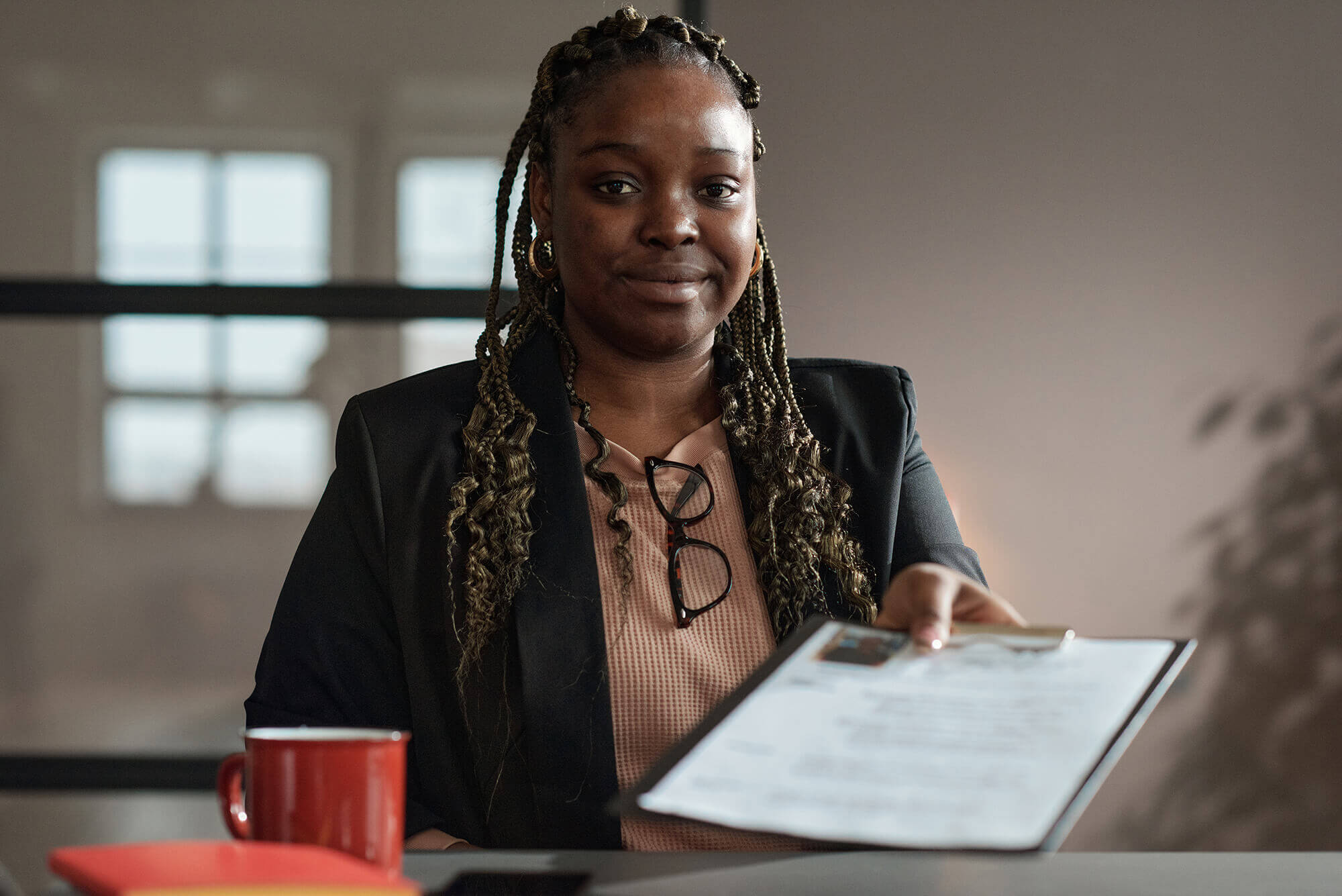 young-woman-giving-her-resume-at-interview-2022-04-27-01-51-17-utc-1.jpg